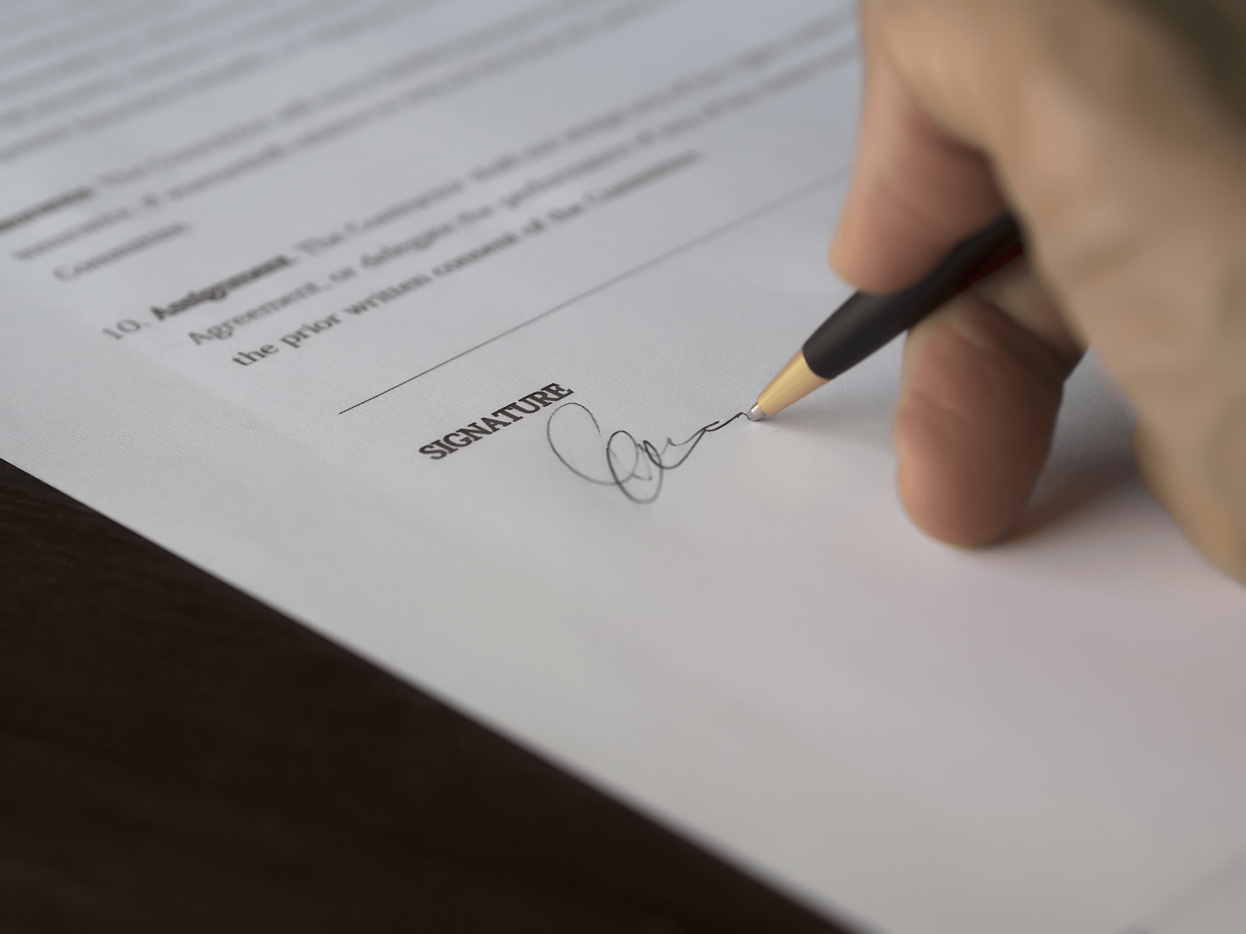 A man signing an industrial cleaning contract in Danville, VA