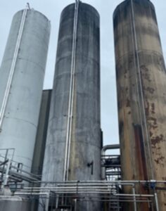 three silos needing industrial painting