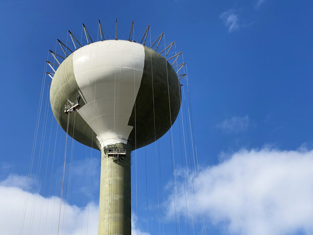 Industrial painting a water tower