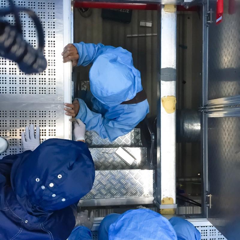 Industrial safety team with protective gear following protocols during facility operations in Alabama
