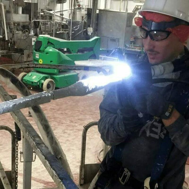 Industrial technician with safety equipment during industrial maintenance at a facility in Alabama