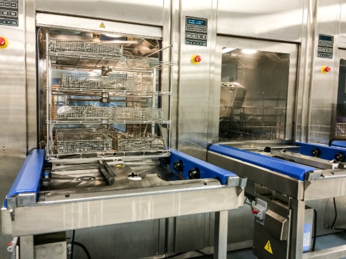A spacious industrial kitchen with ovens
