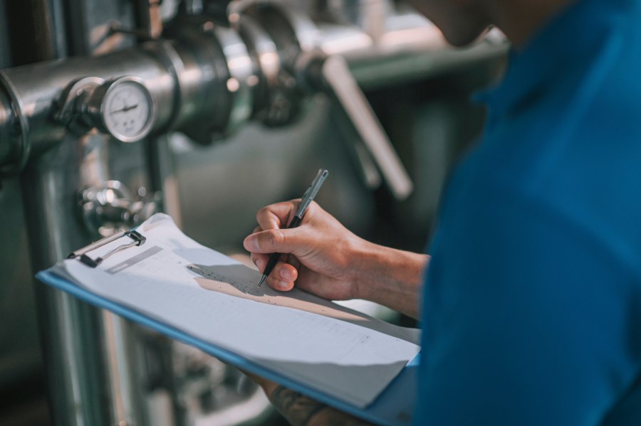 Technician completing an MSHA safety inspection checklist